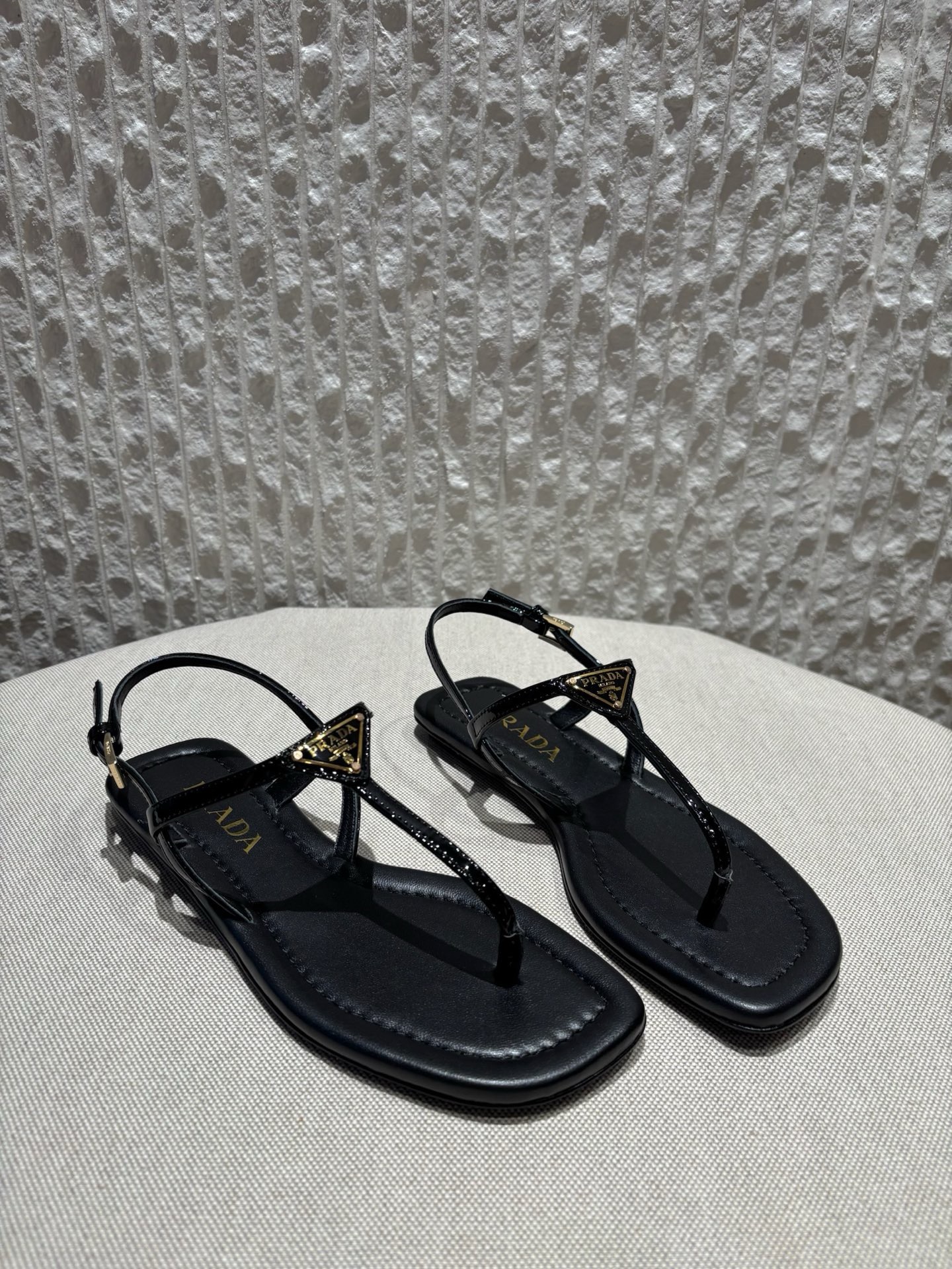 프라다 Prada Triangle Logo T-Strap Flat Sandals Black