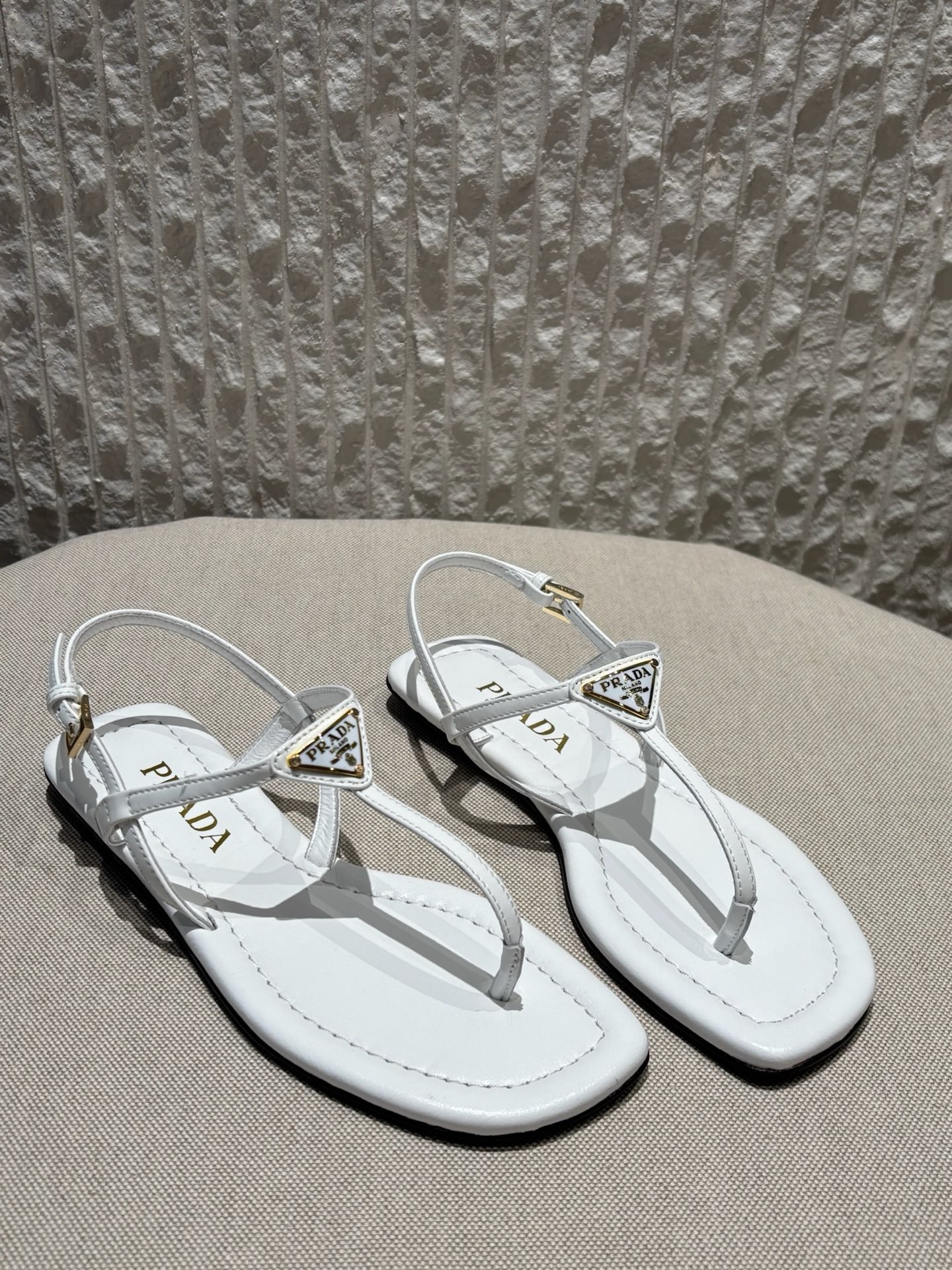 프라다 Prada Triangle Logo T-Strap Flat Sandals White